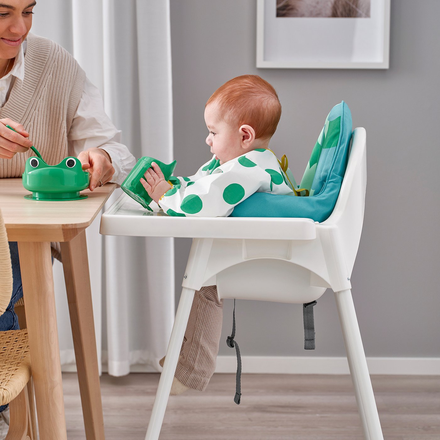 IKEA ANTILOP high chair used at a dining table with an adult nearby